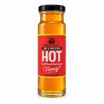 Hot Honey 12oz glass jar with black lid on a white background