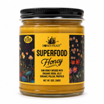 Honey Feast Superfood Honey with royal jelly, bee pollen and propolis in a 12oz glass jar on a white background