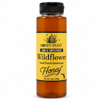 Honey Feast Wildflower Honey 12oz plastic squeeze bottle with the original yellow honeycomb label, on a pure white background