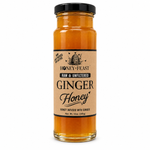Honey Feast Ginger Honey in a 12oz glass jar with black lid on a white background