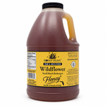 Honey Feast Wildflower 6lb bulk honey in a frosted HDPE plastic jug, with a wide 48mm cap and handle on the right, on a white background.