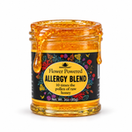 Allergy Blend honey coating the rim and dripping down an open 3oz Honey Feast glass jar