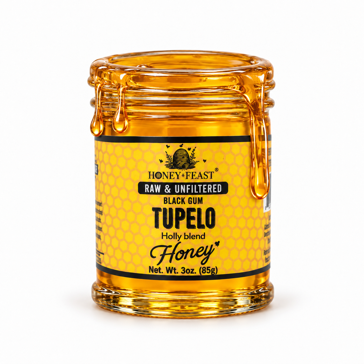 Black Gum Tupelo honey coating the rim and dripping down an open 3oz Honey Feast glass jar
