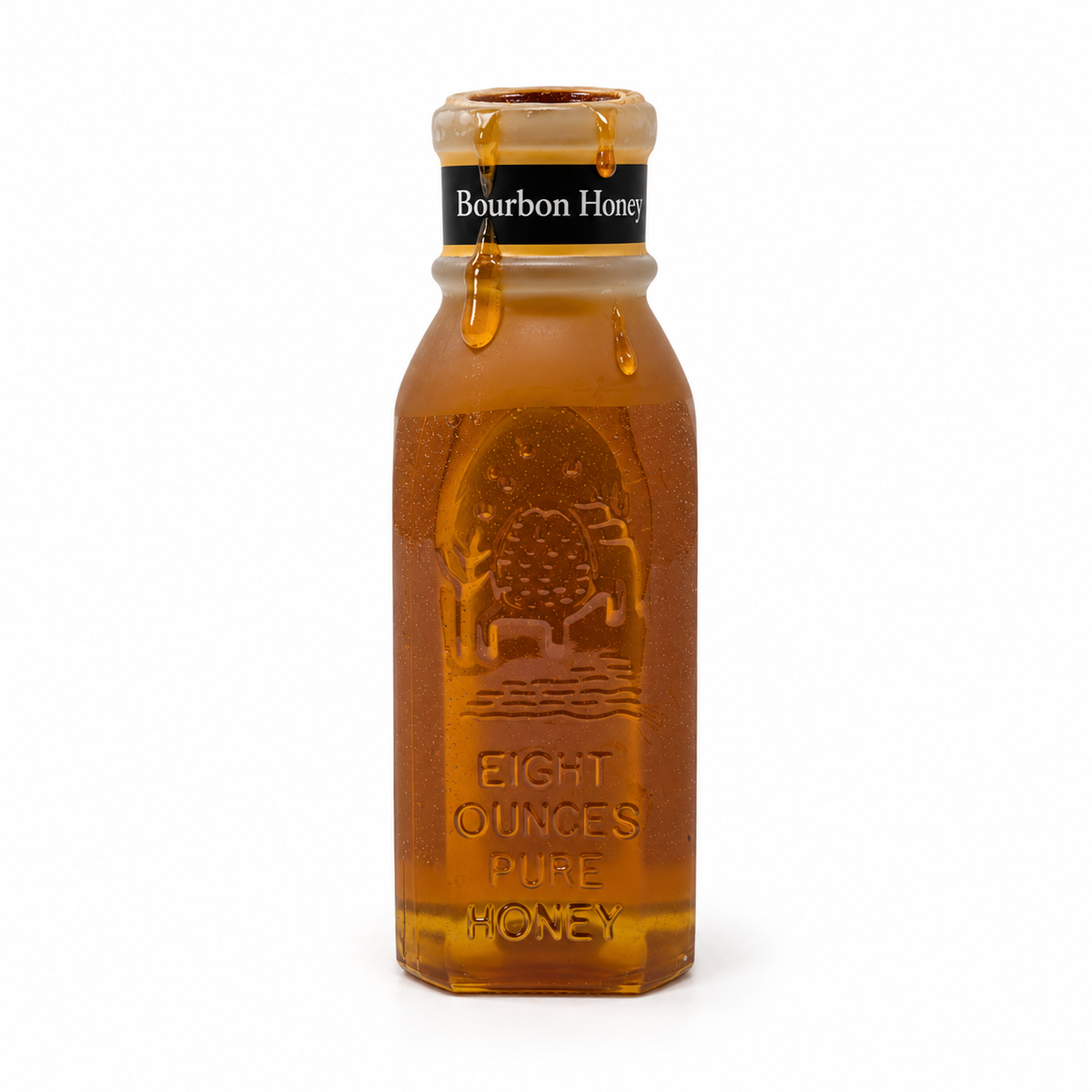 Honey dripping from the open wax-covered rim of Honey Feast Bourbon Honey in an 8oz Muth glass jar on white.