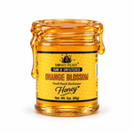 Orange Blossom honey coating the rim and dripping down an open 3oz Honey Feast glass jar