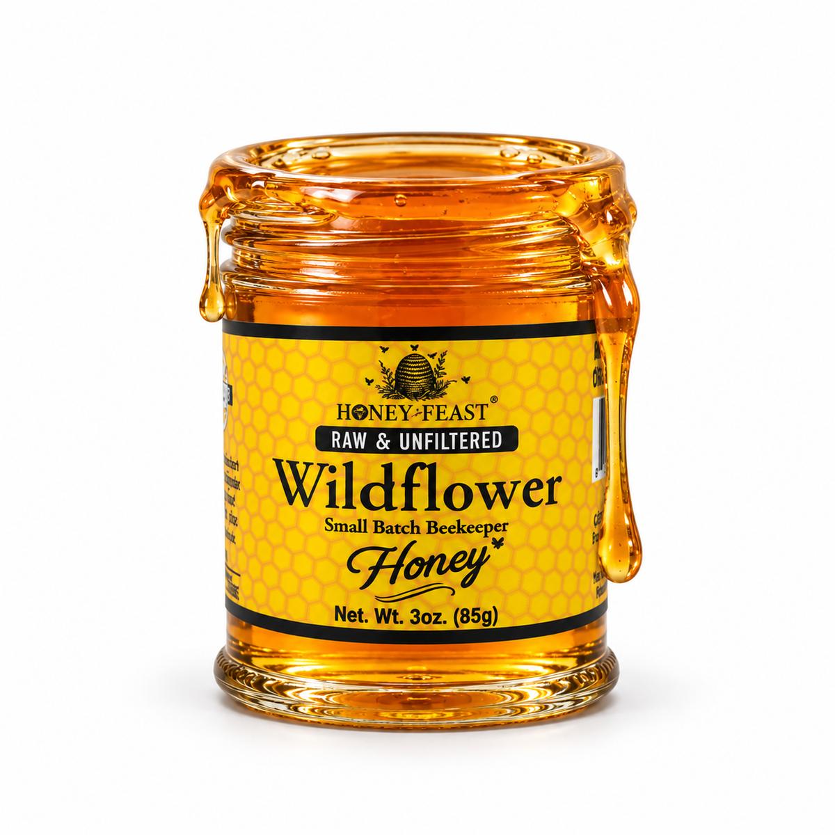 Wildflower honey coating the rim and dripping down an open 3oz Honey Feast glass jar