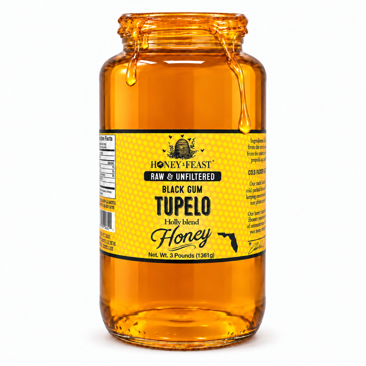 Honey Feast Black Gum Tupelo honey in an open 3lb glass jar, with honey dripping over the rim, on a white background.