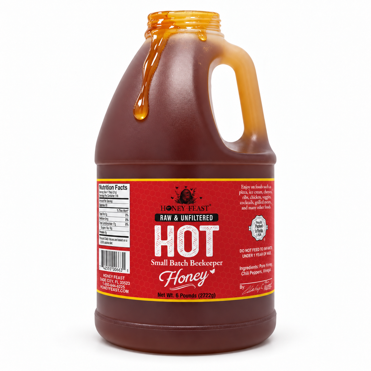 Honey Feast Hot 6lb bulk honey in a frosted HDPE plastic jug with the handle on the right, with honey dripping over the open rim on a white background.