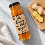 Honey Feast Ginger Honey glass jar with fresh ginger root and slices