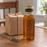 Honey Feast Lavender Honey 8oz Muth glass gift jar with a cork and hand-dipped beeswax finish, in a simple gifting scene.