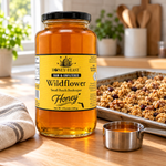 Honey Feast Wildflower Honey – 3lb Glass Jar beside a batch of homemade granola