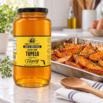 Honey Feast Black Gum Tupelo Honey – 3lb Glass Jar beside a tray of honey-roasted sweet potatoes