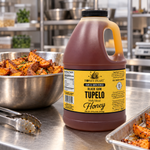 Honey Feast Black Gum Tupelo 6lb bulk honey in a frosted HDPE plastic jug with the handle on the right, commercial sweet potato prep.