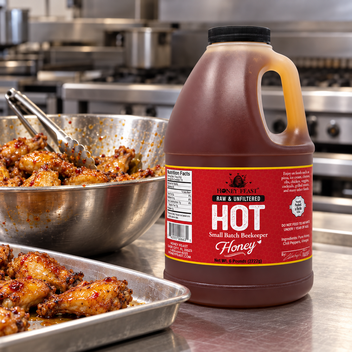 Honey Feast Hot 6lb bulk honey in a frosted HDPE plastic jug with the handle on the right, commercial wing prep.