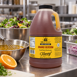 Honey Feast Orange Blossom 6lb bulk honey in a frosted HDPE plastic jug with the handle on the right, commercial vinaigrette prep.