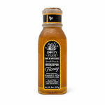 Back label of Honey Feast Bourbon Honey 8oz Muth glass gift jar, showing the Honey Feast label, net weight and infant warning.