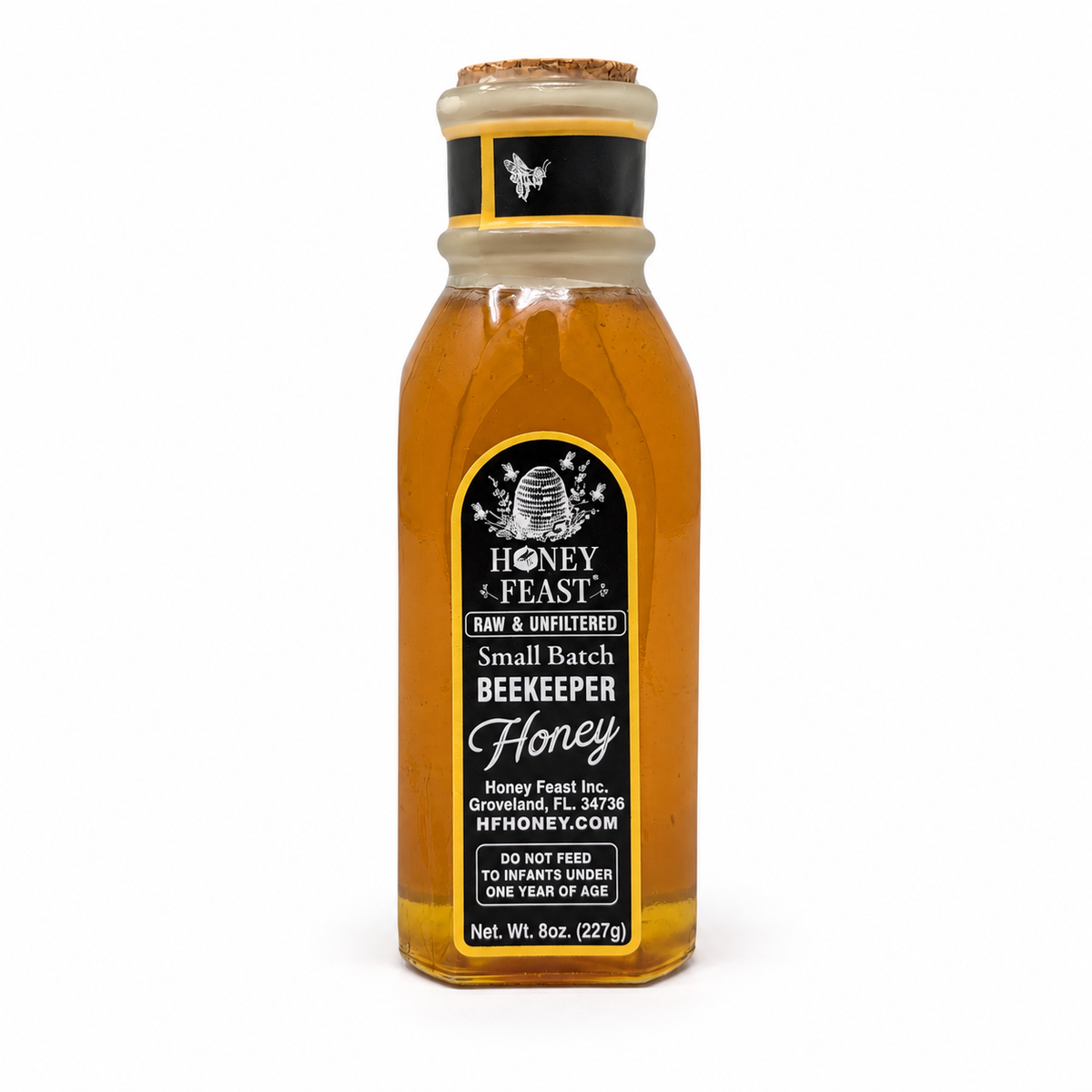 Back label of Honey Feast Lavender Honey 8oz Muth glass gift jar, showing the Honey Feast label, net weight and infant warning.