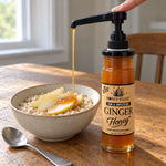 Ginger honey dispensed over pear oatmeal with the optional honey pump, sold separately
