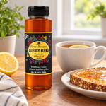 Honey Feast Allergy Blend Honey 12oz plastic squeeze bottle beside a cup of lemon tea and honey-covered toast