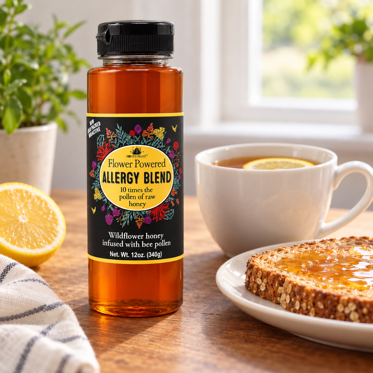 Honey Feast Allergy Blend Honey 12oz plastic squeeze bottle beside a cup of lemon tea and honey-covered toast