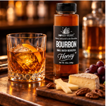 Honey Feast Bourbon Honey 12oz plastic bottle in a warm bourbon-inspired serving scene