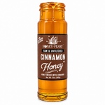 Honey Feast Cinnamon Honey in an open 12oz glass jar with honey dripping down the side