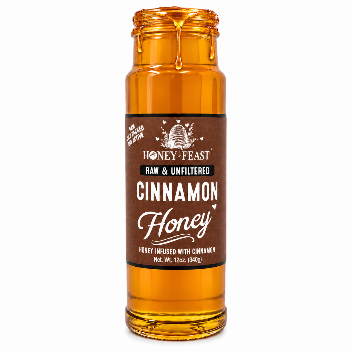 Honey Feast Cinnamon Honey in an open 12oz glass jar with honey dripping down the side