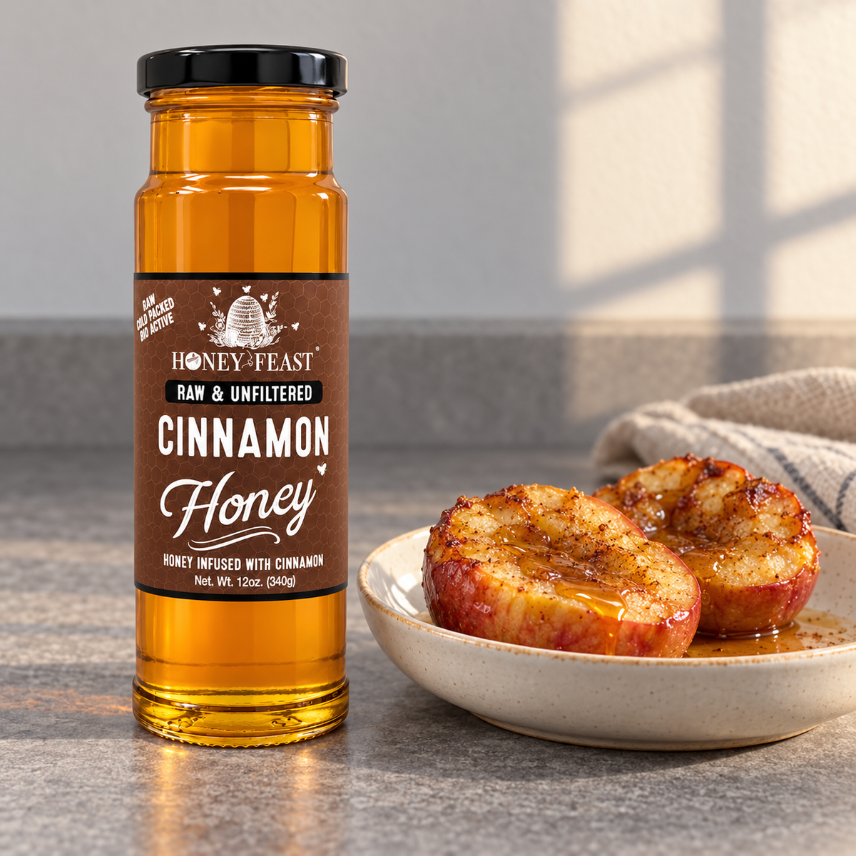 Honey Feast Cinnamon Honey 12oz glass jar beside baked apples