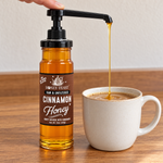 Honey Feast Cinnamon Honey 12oz glass jar with optional honey pump beside coffee; pump sold separately