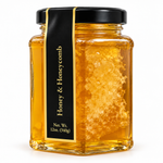 Honey and Honeycomb 12oz glass hexagon jar on a white background