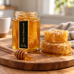 Honey and Honeycomb jar with honeycomb on a wooden board