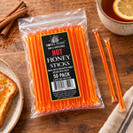 Hot Honey Sticks 50-pack lying flat in a simple serving scene with full-length loose sticks