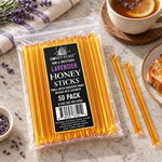 Honey Feast Lavender Honey Sticks 50-pack lying flat beside honey toast and tea, with full-length loose sticks