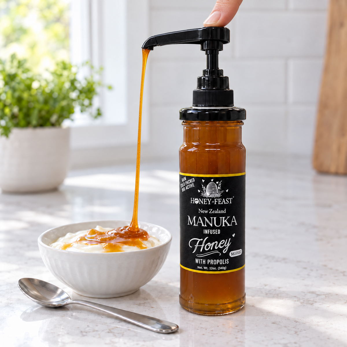 Honey Feast Manuka infused honey 12oz glass jar with optional honey pump beside yogurt; pump sold separately