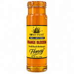 Honey Feast Raw Orange Blossom Honey in an open 12oz glass jar with honey dripping down the side