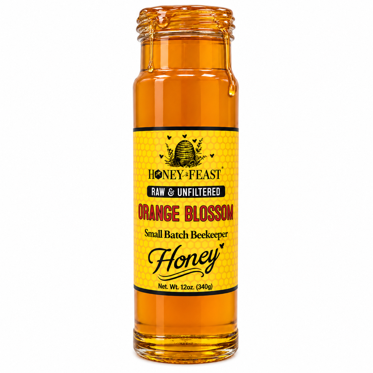 Honey Feast Raw Orange Blossom Honey in an open 12oz glass jar with honey dripping down the side