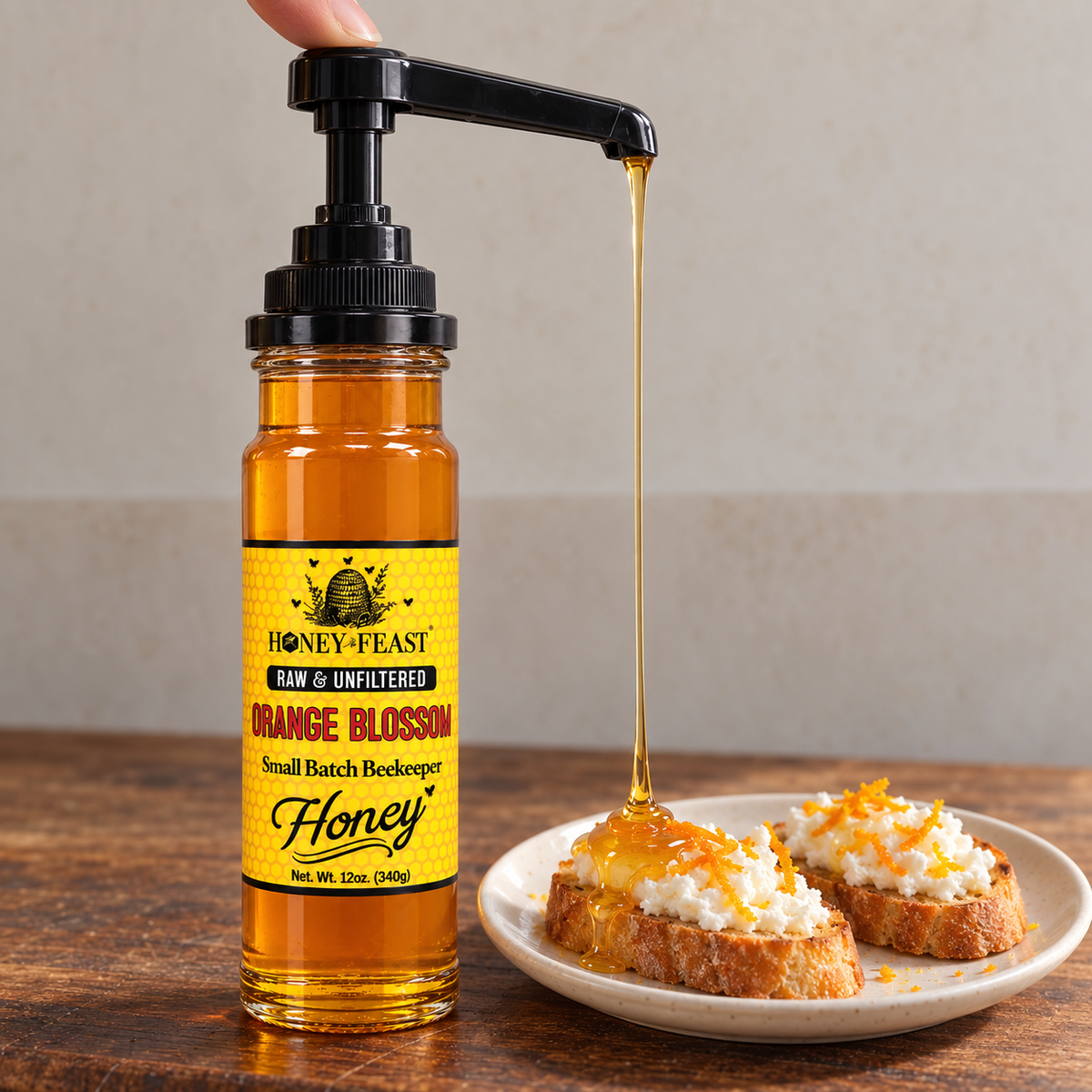 Honey Feast Raw Orange Blossom Honey 12oz glass jar with optional honey pump beside ricotta crostini; pump sold separately