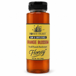 Honey Feast Orange Blossom Honey 12oz plastic squeeze bottle with the original yellow honeycomb label, on a white background