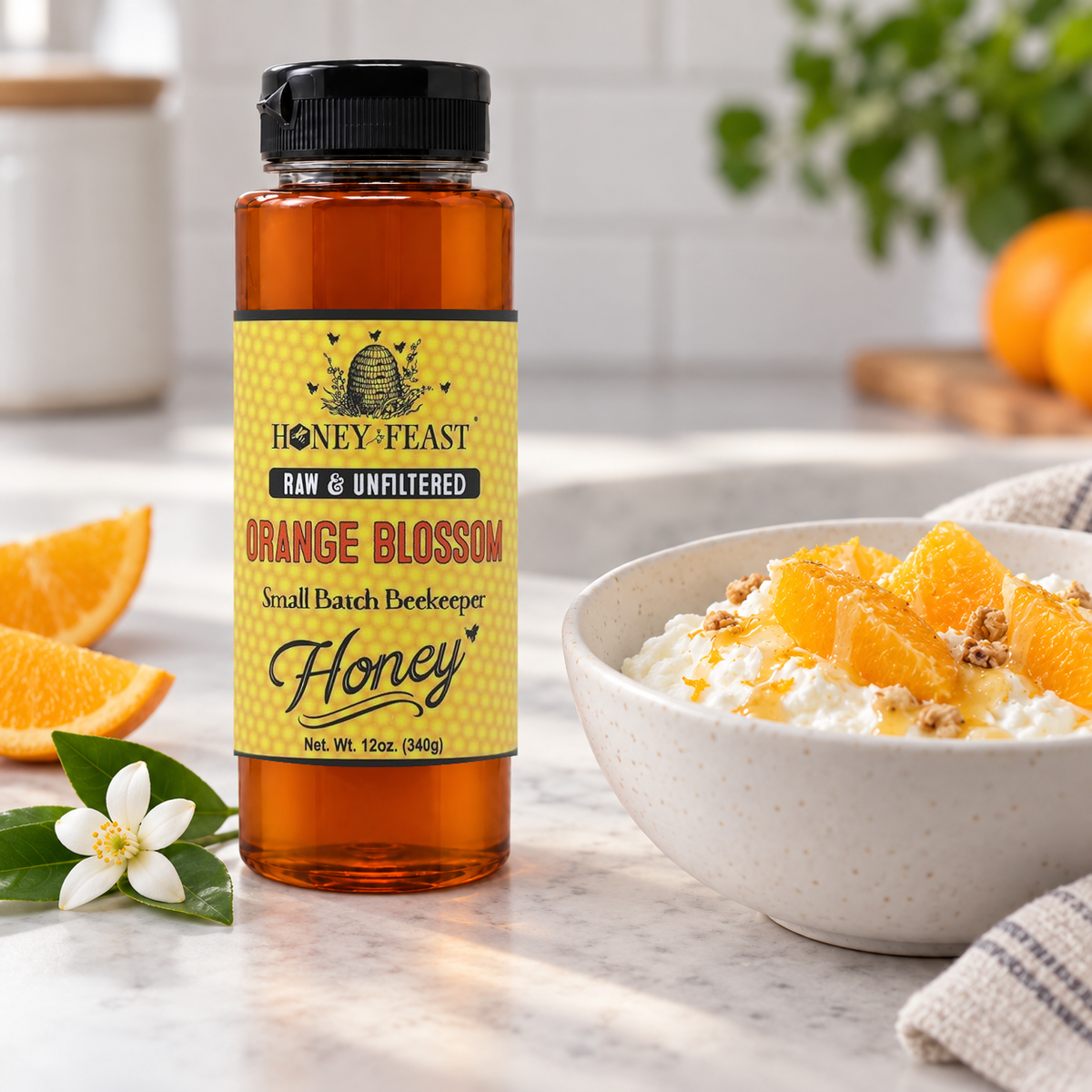 Honey Feast Orange Blossom Honey 12oz plastic squeeze bottle with its original yellow label beside a breakfast bowl with orange segments and honey