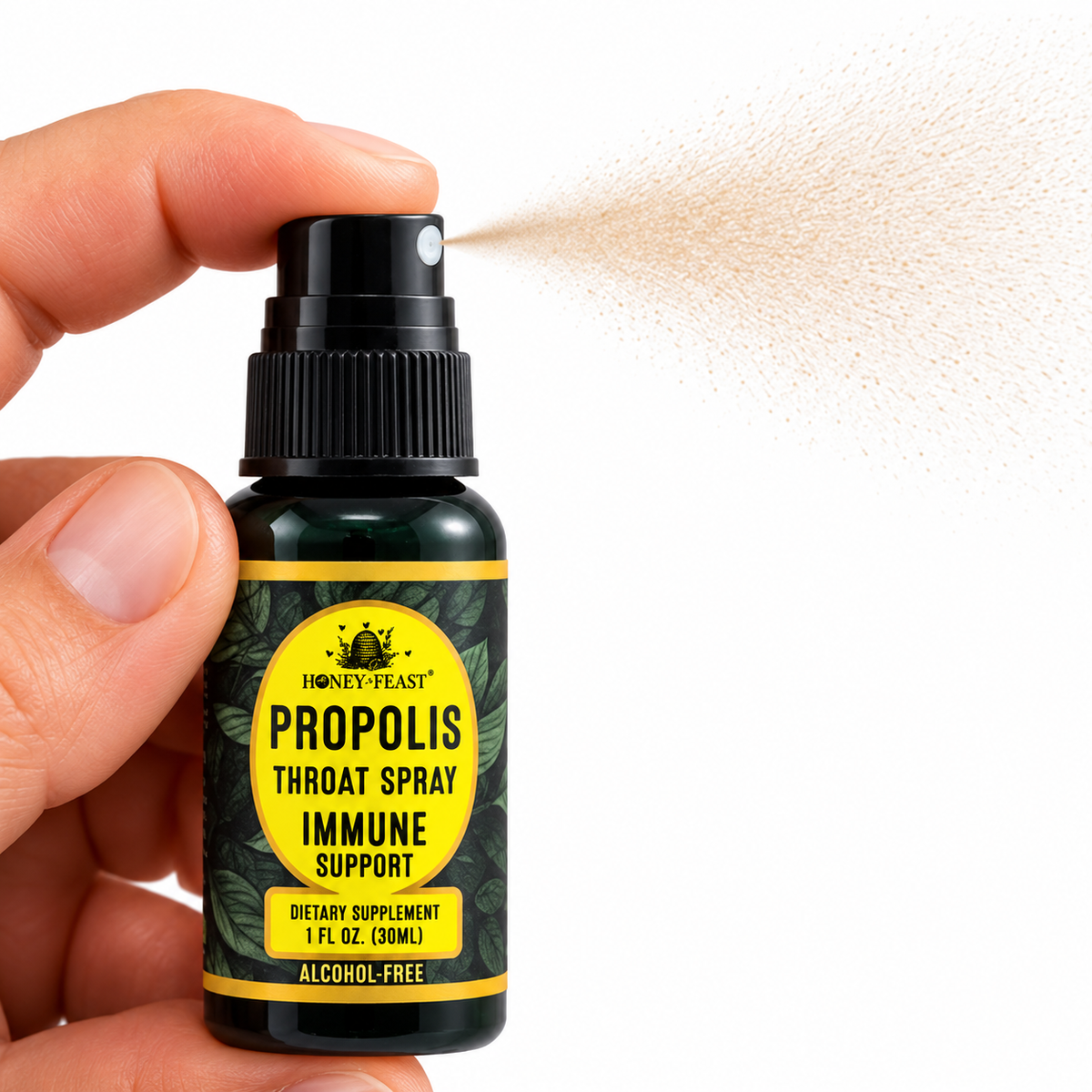 Honey Feast Propolis Throat Spray with finger pressing the pump and a light brown mist on a pure white background