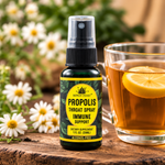 Honey Feast Propolis Throat Spray beside tea in a natural lifestyle setting