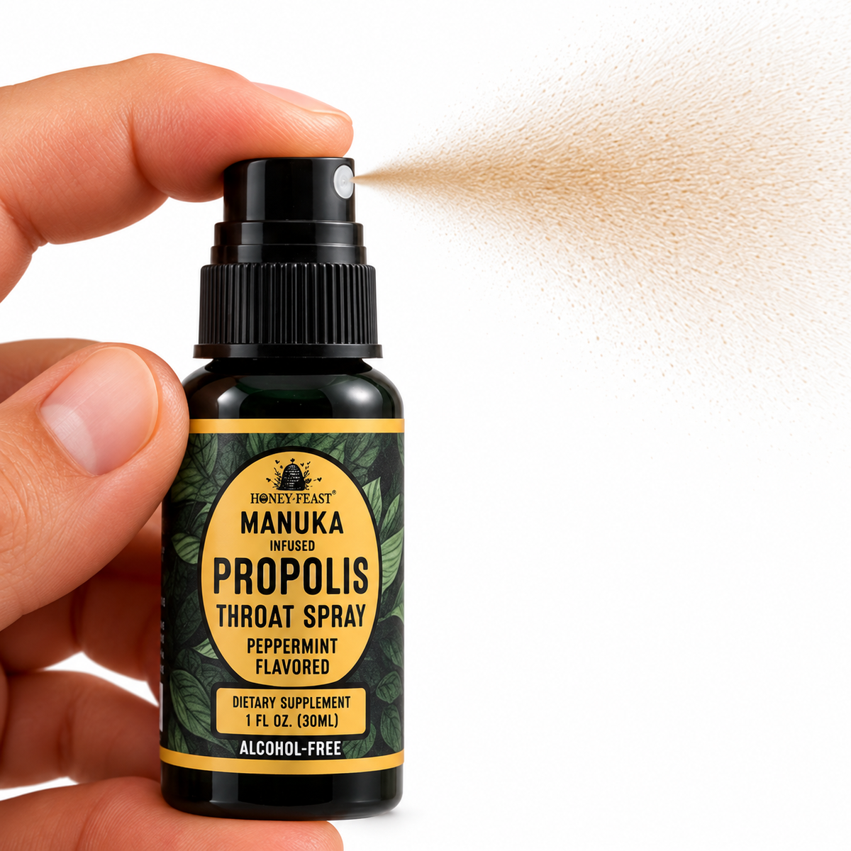 Honey Feast Manuka-Infused Peppermint Propolis Throat Spray with finger pressing the pump and a light brown mist on a pure white background