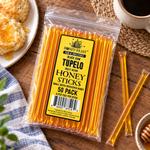 Black Gum Tupelo Honey Sticks 50-pack lying flat beside coffee and biscuits, with full-length loose sticks