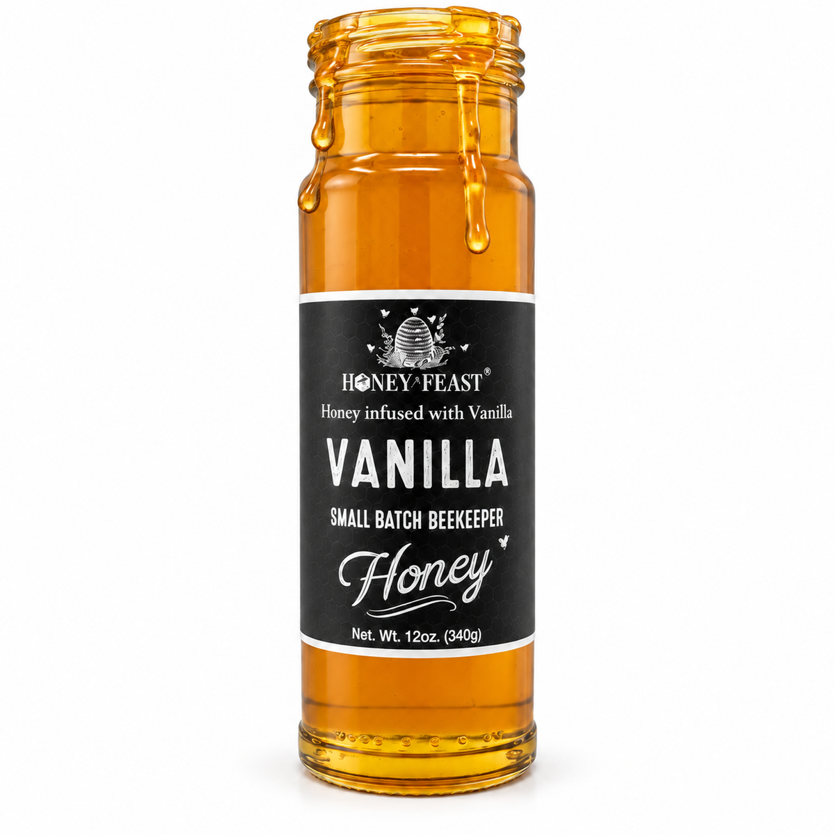 Vanilla infused honey glass jar with lid removed and honey dripping down the jar